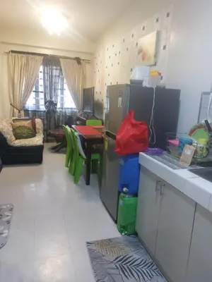 a kitchen and living room with a table and a counter at Florida sun estates condo in General Trias