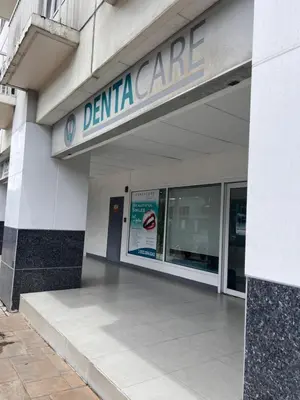 a dental care building with a sign on it at Sea Residences MOA Manila By Paul XIVI in Manila