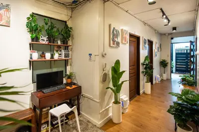 an office with a desk with a computer and plants at Homey and Cozey Poblacion Makati S03 in Manila