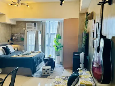 a bedroom with a bed and a room with a sink at Luxurious Viceroy Residence Walk to Venice Grand Canal in Manila