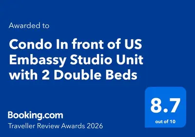 a blue sign with the words combo in front of us embassy suburb unit with at Condo In front of US Embassy Studio Unit with 2 Double Beds in Manila