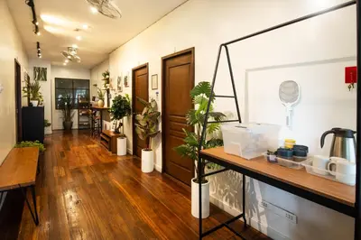 a hallway with potted plants in a room at Homey and Cozey Poblacion Makati S11 in Manila