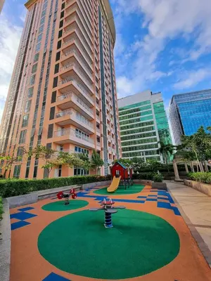 a playground in the middle of a city with tall buildings at Elegant Venice Condo Mckinley Hill BGC #vlrtc5i in Manila