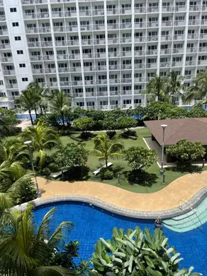 an overhead view of a large apartment building with a swimming pool at Santa Place Shore Residences Tower A in Manila