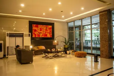 a living room with a couch and a table at Elivion Staycations at McKinley Hill, near Venice, BGC, with Pool & Wifi in Manila