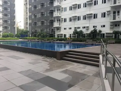 a swimming pool in the middle of a building at A & Y Staycation in Manila