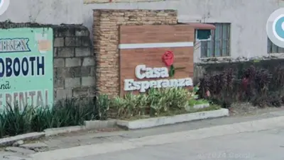 a brick building with a sign that says cafe experience at Family Airconditioned Room with Balcony & Parking in Cabuyao 2-storey house in Cabuyao