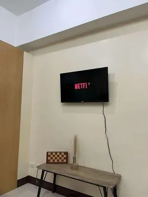 a tv on the wall in a room at The Viceroy Tower1 condominium in Manila