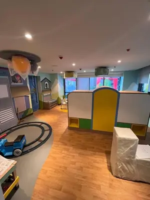 a living room with a play room with a toy house at GENTRY MANOR fast WiFi,Balcony near Okada,MOA&NAIA 8Q in Manila