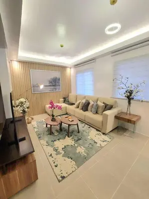 a living room with a couch and a table at Luxa House Staycation Tagaytay in Panungyanan