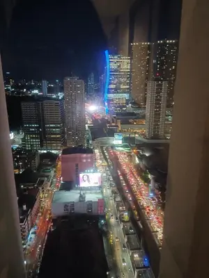 a view of a city at night with traffic at Nics Condotel - Mandaluyong Along Edsa in Manila