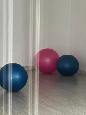two balls sitting on the floor next to a wall at Mi Casa - Cozy Studio with FREE access to Fitness Centre, swimming pool and stunning City View located near the CBD of Ortigas, Makati, BGC in Manila