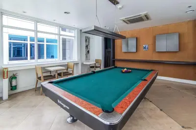 a living room with a pool table in it at Japanese Stylish Condo in Makati in Manila