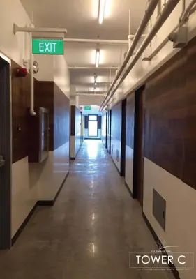 an empty hallway in an office building with a street sign at The Cozy Corner in Manila