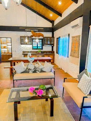 a living room with two couches and a table at Kasa Silang by Araw Residences in Cavite