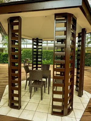 a patio with a table and chairs under a pavilion at Natural Haven at South in Manila