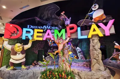 a sign for the disneyrozen dream play exhibit at City of Dreams - Nobu Hotel Manila in Manila