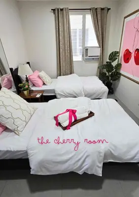a hotel room with two beds with the dirty room written on them at Playful comfort and Serene relaxation in Cubao in Manila