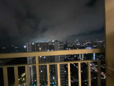a view of a city skyline at night at Coast Stay by J 41st floor Penthouse in Manila