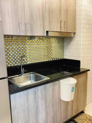 a kitchen with a sink and a counter top at Coast Stay by J 41st floor Penthouse in Manila