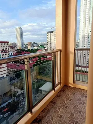 a balcony with a view of a city at Explore Manila Trendy 1BR unit in Birch Tower in Manila
