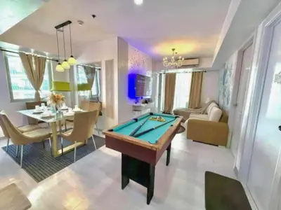 a living room with a pool table at Azure Resort Paranaque deluxe room unit 1601 st tropez tower in Manila