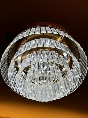 a chandelier hanging from a ceiling at Grand Suites Shore 3 Residences in Manila