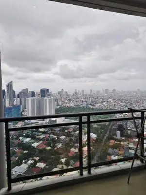 a view of the city from the balcony of a building at Christine Suites PH 1BR with Balcony Gramercy Residences Makati in Manila