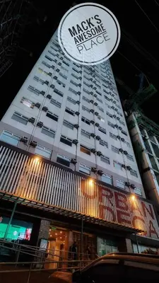 a large building with a sign on the side of it at Macks Awesome Place 22 Fast Wifi Premium Netflix in Manila