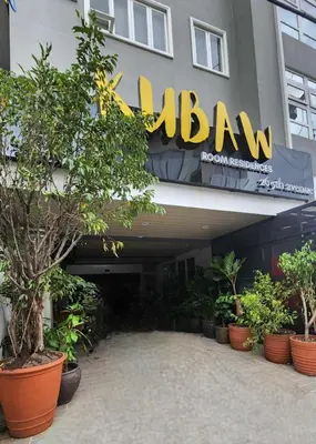 a building with aazon sign on the side of it at Boudoir Hideaway close to Araneta Center in Manila