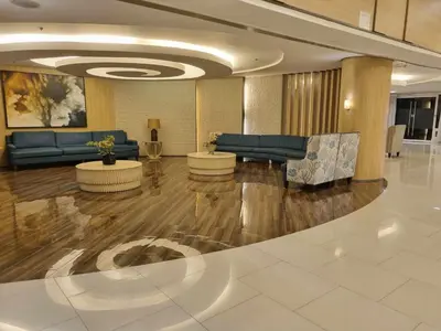 a lobby with couches and tables in a building at Shell Residences - 1 br no balcony in Manila