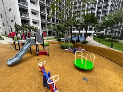a playground with a slide and a slideintend at Shore 2 2-Bed Balcony City View WiFi Netflix near MOA 834 in Manila