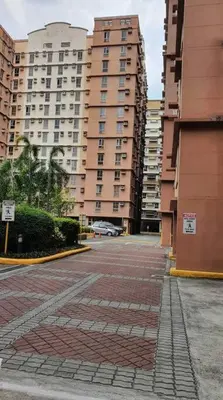 an empty street in a city with tall buildings at Near Manila Airport COZY 01 Bedroom Condo - 10L in Manila