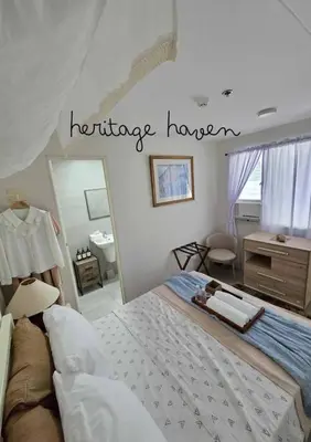 a bedroom with a large bed and a bathroom at Tranquil Haven Relaxing Retreat near Araneta in Manila