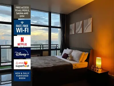 a hotel room with a bed and a large window at Premium Suite with Balcony at The Gramercy Makati Manila in Manila