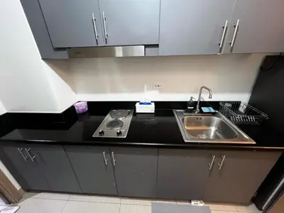 a kitchen with a sink and a counter top at 1 BR Apartment near SM Mall of Asia, Airport, Manila in Manila