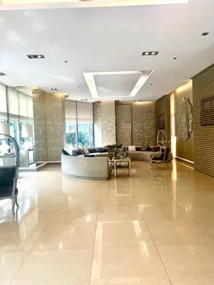 a lobby with a couch and a table at 9D Standard Room staycation in Manila