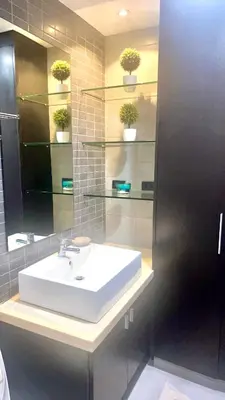 a bathroom with a white sink and a mirror at 9D Standard Room staycation in Manila