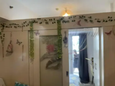a room with a door with decorations on the wall at That Boho Crib 1bedroom with Balcony facing amenities in Manila