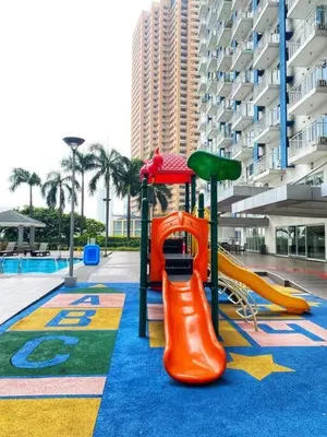 a playground with a slide at That Boho Crib 1bedroom with Balcony facing amenities in Manila
