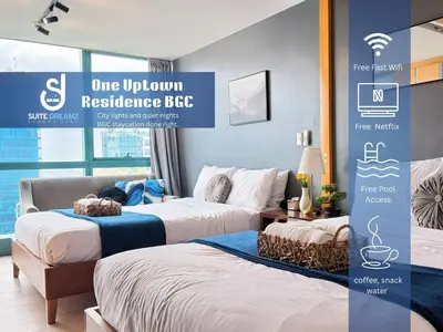 a room with two beds and a sign that reads one unknown residence bee at BGC High Rise, Uptown Mall Link, 5G WiFi, Pool, Ste 29 in Manila
