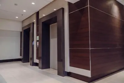a hallway with wood paneled walls in a building at Comfy and Cozy Retreat in Manila with a Stunning View in Manila