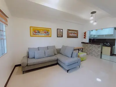 a living room with a couch and a chair at JeSa's Serenity Sanctuary in Dasmariñas