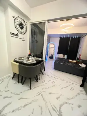 a room with a table and a bed in a room at Affordable Azure Staycation in Manila
