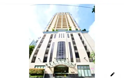 a tall white building with a lot of windows at 20C Staycation away from home in Manila