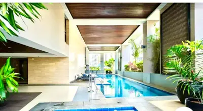 a swimming pool in a house with plants at 20C Staycation away from home in Manila