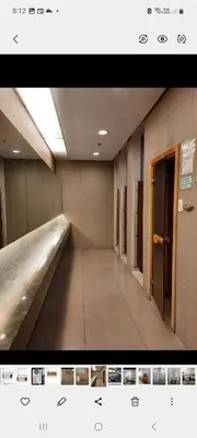 an empty hallway in a building with a hallway at Quaint Aparthotel T22306 in Manila
