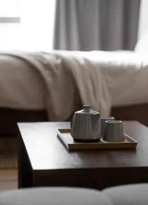 two tea pots on a tray on a coffee table at Sarannya Home BGC in Manila