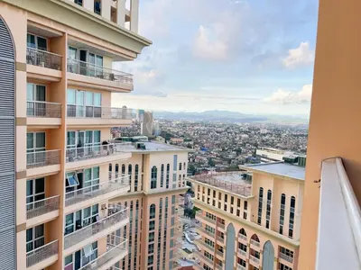 a view of the city from a building at Cozy Condo in Venice BGC with balcony #vlrtc28C in Manila