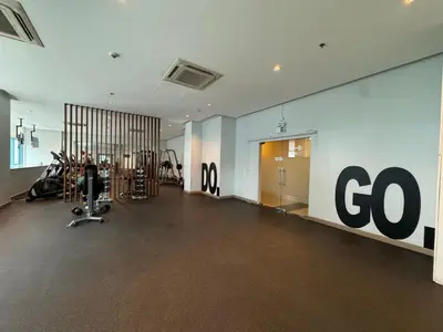 a gym with a go sign on the wall at Rustic Elegance New One Bedroom One Uptown Free parking in Manila